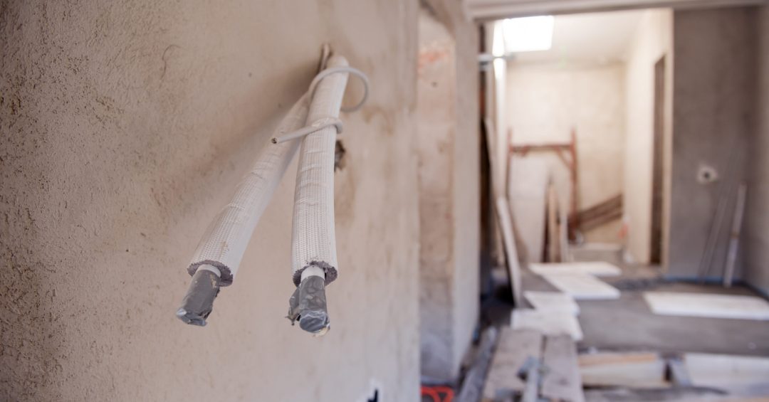Socket back boxes with wires in a wall. Cabling background. electrical wires sticking out from electrical sockets hole on the wall. New electrical wiring installation